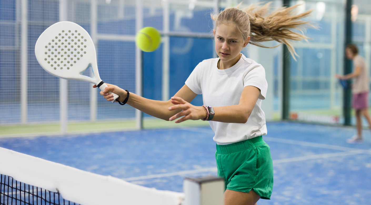 A young girl training at ISD Padel Academy