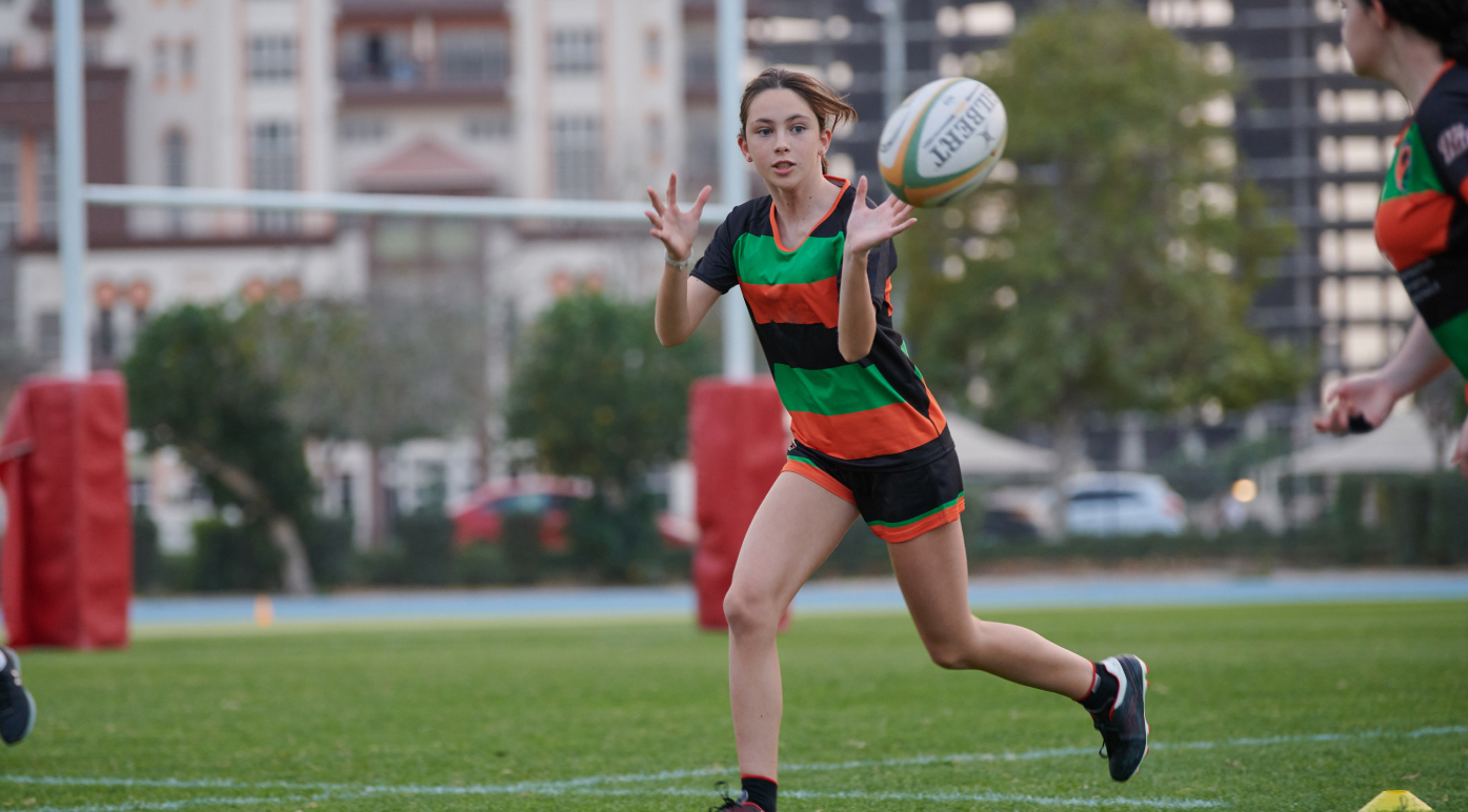 A young girl practicing at the ISD Rugby Academy